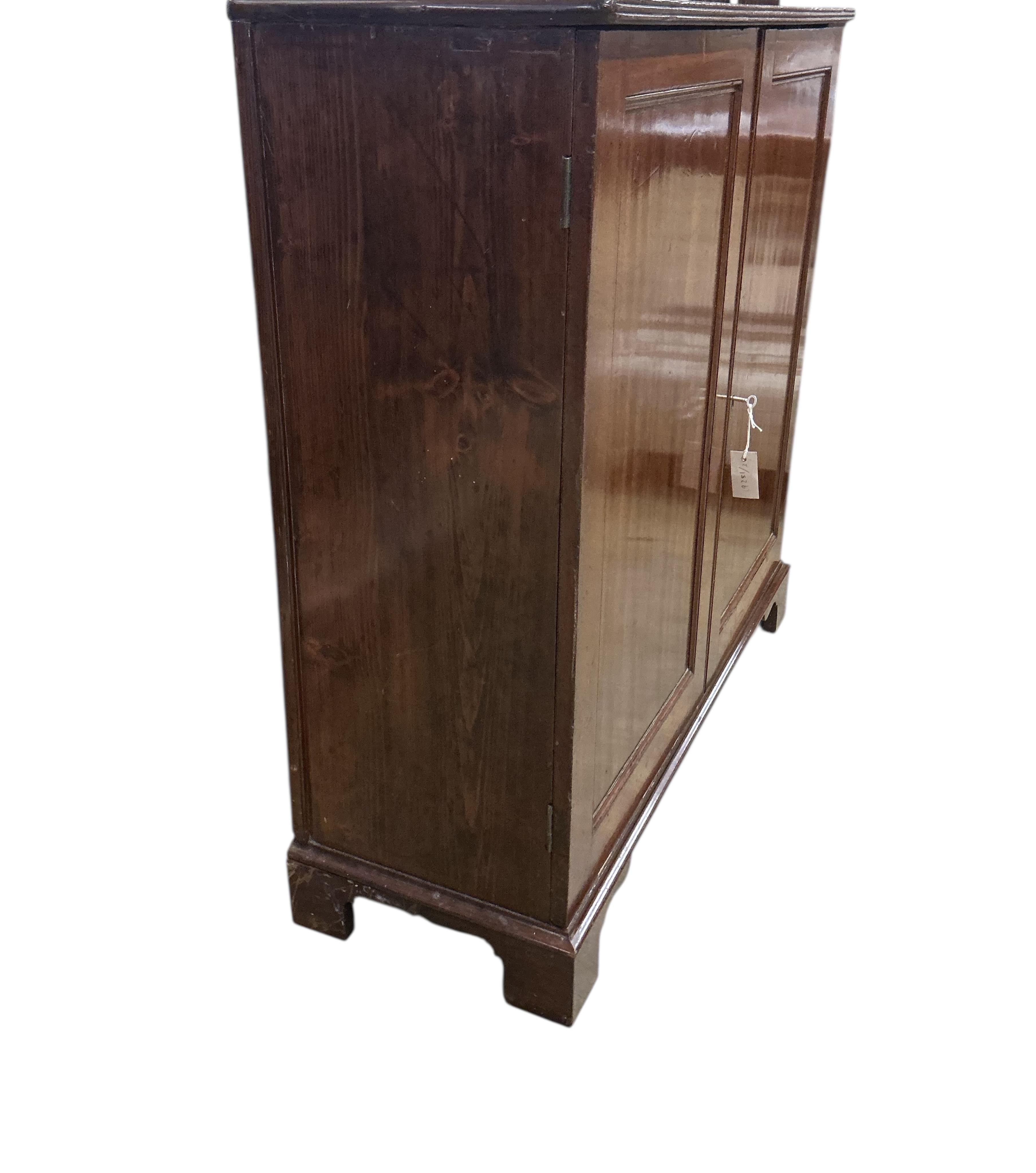 An early 19th century mahogany two door side cabinet, width 103cm, depth 37cm, height 104cm